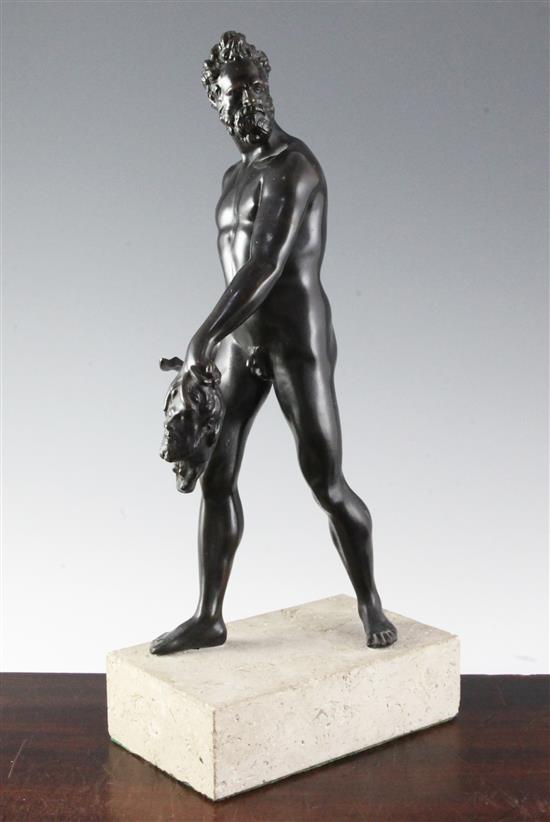 After the antique. A bronze figure of Hercules carrying a sword and a head, 16.5in.